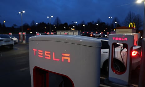 Charging station in dark with Tesla sign