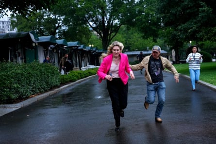 Members of the media run from the North Lawn