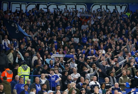 Leicester City fans inside the stadium cheering their team before the match.