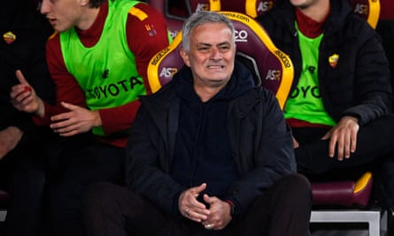 José Mourinho watches anxiously in his seat.