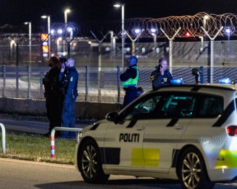 Danish police patrol at Copenhagen Airport, Denmark after reported drone sightings disrupted its operations.