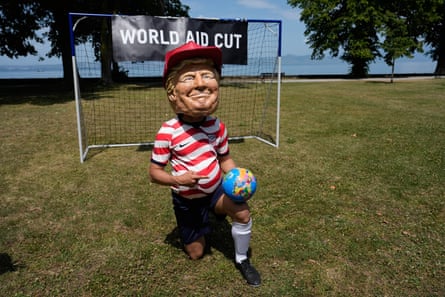 Oxfam’s satirical ‘big head’ of president Donald Trump kitted out as a footballer during the G7 summit in France