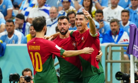 Bruno Fernandes (centre) celebrates his opening goal for Portugal with Cristiano Ronaldo and Bernardo Silva.