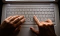 a woman's hands using a laptop keyboard