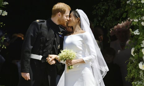 Prince Harry and Meghan Markle kiss on the steps of St George’s Chapel in Windsor Castle after their wedding.