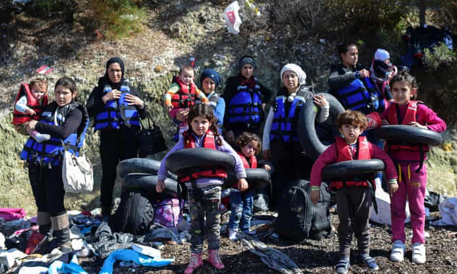 Syrian migrants prepare to board a dinghy to cross the Aegean Sea to the Greek island of Lesbos from the Ayvacik coast in Canakkale.