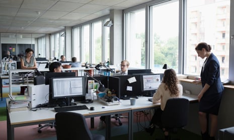White business people working in open plan office