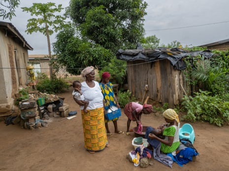 Kouassi Akissi Jeanne with her family at their Ivory Coast village.