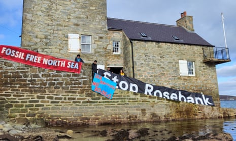 Protesters in Shetland demonstrate with banners reading Fossil Free North Sea and Stop Rosebank as part of coordinated action
