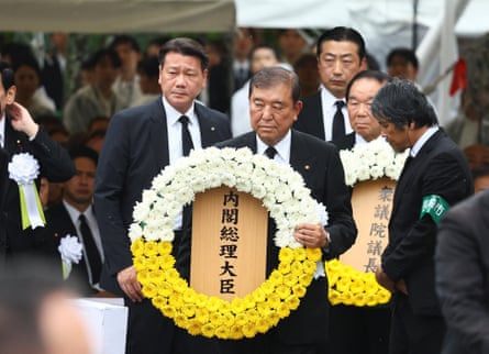 Japan’s prime minister, Shigeru Ishiba, offers a wreath at a ceremony at Nagasaki’s Peace Park.
