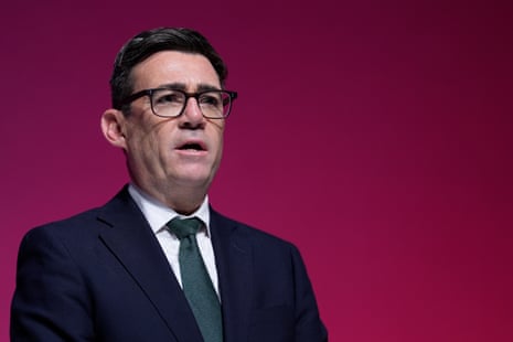 Andy Burnham speaking on stage.