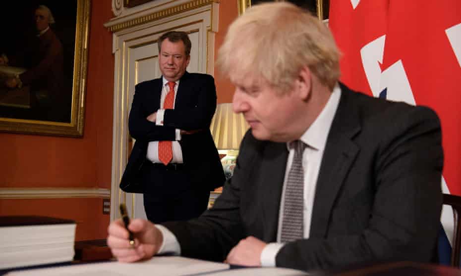 The UK prime minister, Boris Johnson, signs the Brexit trade deal with EU in Downing Street in December, 2020. 