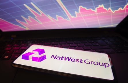 NatWest logo on a phone lying on a keyboard