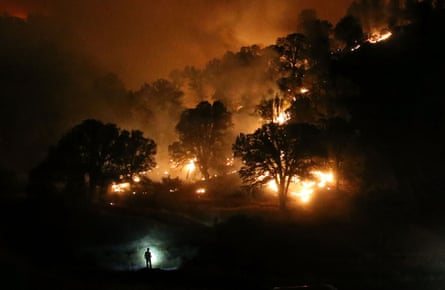 A firefighter monitors a backfire near Clearlake, California. The Rocky Fire burned over 60,000 acres and forced the evacuation of 12,000 residents.