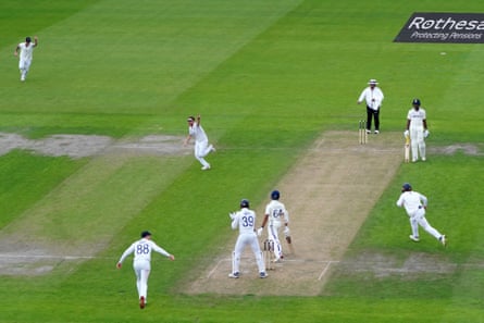 Dawson (arm aloft) runs off in celebration after dismissing Yashasvi Jaiswal.