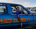 A young boy, 12, sits in his car waiting to drive at the Wheelz n Smoke Arena spinning event