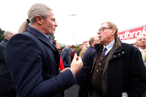 Harry Redknapp (right), who owns King George fancy The Jukebox Man, speaks with former football player Emmanuel Petit on King George VI Chase Day at Kempton last year.