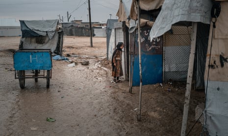 A girl is seen next to a tent in the al-Hawl camp in northeastern Syria.