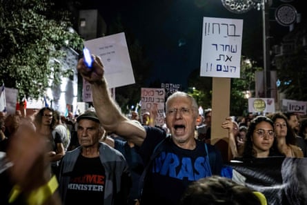 Israeli demonstrators shouting slogans against Benjamin Netanyahu during an anti-government protest in Jerusalem.