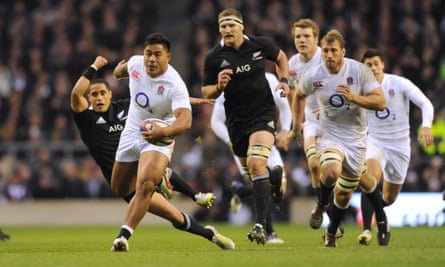 Manu Tuilagi leaves New Zealand’s Aaron Smith trailing in his wake in 2012.