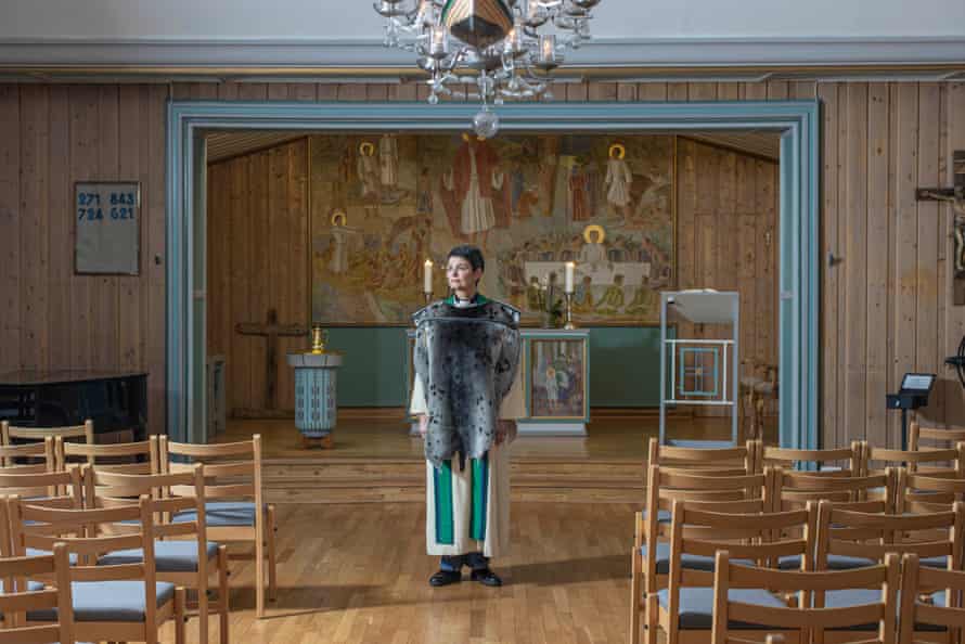 Siv Limstrand in the church of Longyearbyen wearing a polar saddleback seal tailored clothing