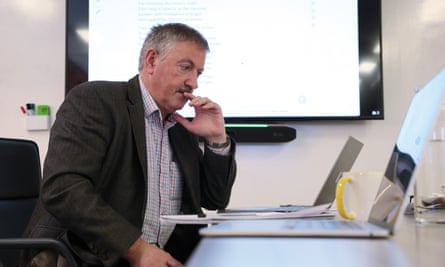 Robert Blackwell looks at a laptop as he tests the chatbots