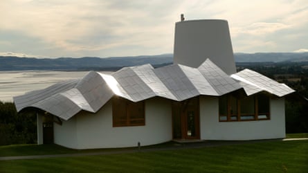 The Maggie’s Center at Dundee’s Ninewells hospital, a short, wide building with an artistic corrugated roof and a short tower