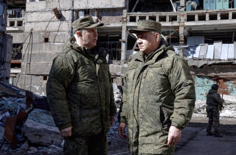 A handout image provided by the Russian Defence Ministry's press service claims to show Russian minister of defence Sergei Shoigu (C) and commander of Russia's eastern military district Gen Rustam Muradov (L) during his inspection of the positions of Russian troops at an undisclosed location in Ukraine over the weekend.