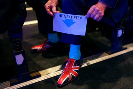 A man wearing shoes with Union flag in them at Reform UK party national conference in Birmingham