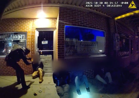 A still from bodycam footage shows a federal agent using a facial recognition app on a detained person. Image has been blurred by the legal team to obscure the identities of those detained.