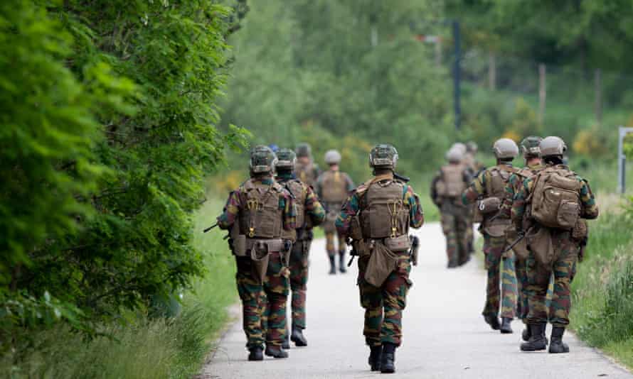 Troops patrol the Nationaal Park Hoge Kempen in Maasmechelen on June 4 as part of the manhunt for Jurgen Conings, a fugitive Belgian soldier.