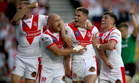 Jack Welsby (second right) celebrates scoring his Saints’ third try with his teammates.