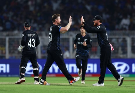 James Neesham and Finn Allen celebrate the wicket of Dewald Brevis.