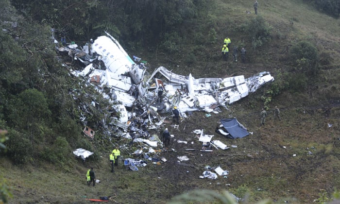 Police officers and rescue workers search for survivors around the wreckage of a chartered airplane that crashed in La Union, a mountainous area outside Medellin, Colombia,