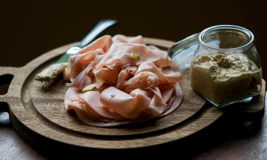 Plate of Mortadella with mustard, a dish many see as the Italian ancestor of bologna.