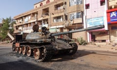 A damaged army tank on the street in Omdurman, Sudan