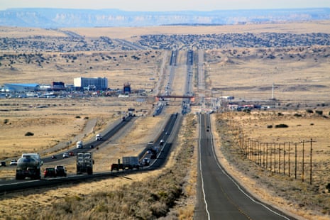 A two-lane stretch of Route 66 runs along an interstate highway