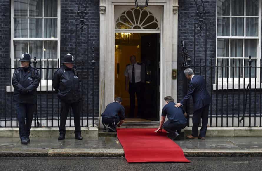 Workers fit red carpet ahead of meeting between Cameron and Xi at No 10