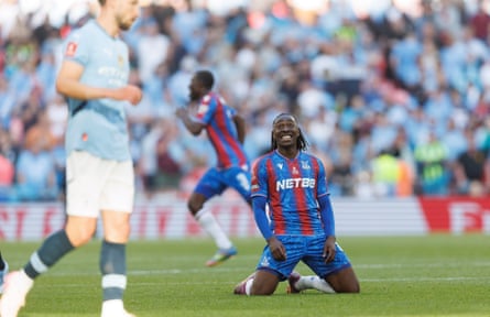 Eberechi Eze collapses to the floor in celebration after Palace beat Manchester City in the FA Cup final