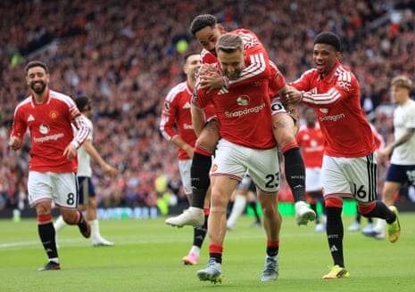 Matheus Cunha leaps on to the goalscorer Luke Shaw.