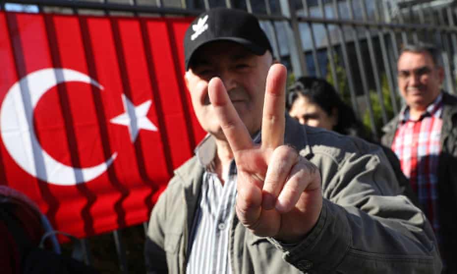 A man heading to the Turkish consulate in Berlin to vote for the Turkish referendum.