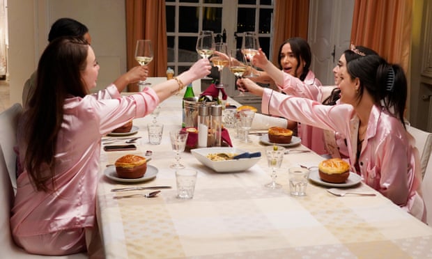 The stars of Real Girlfriends in Paris at a dinner party