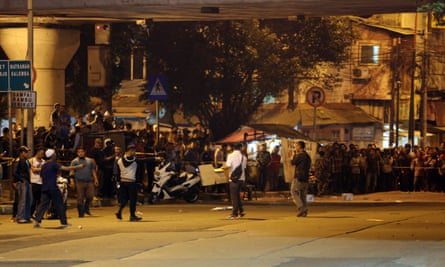 Indonesian police securing the blast site at Kampung Melayu bus shelter on Wednesday