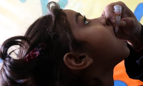 Girl gets polio vaccine in Karachi, Pakistan