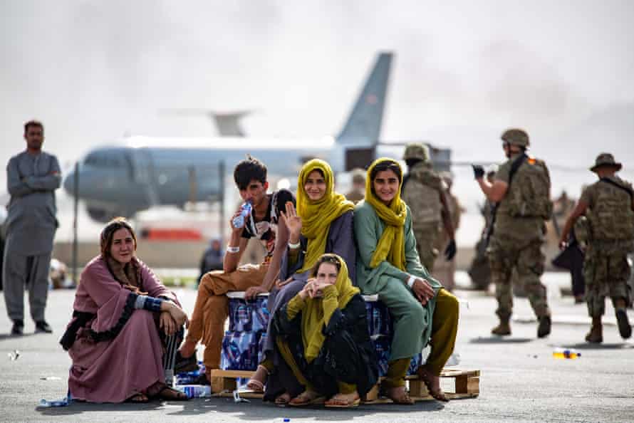 Evacuee children wait for the next flight after being manifested on 19 August at Kabul’s airport.