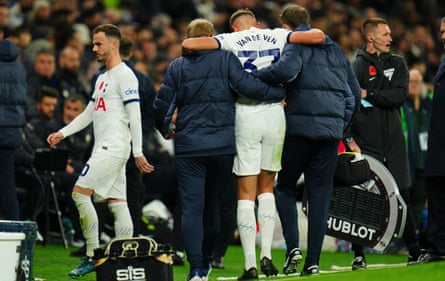 Tottenham’s Micky van de Van is helped off injured with James Maddison, who also went off with an injury, nearby.