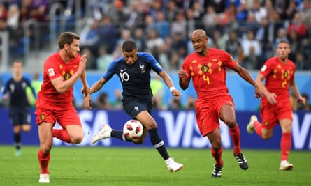 Kylian Mbappé (centre) is shadowed by Jan Vertonghen (left) and Vincent Kompany as France beat Belgium in the 2018 World Cup semi-final.