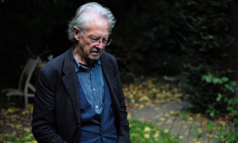Peter Handke poses outside his home near Paris after winning the Nobel prize for literature.
