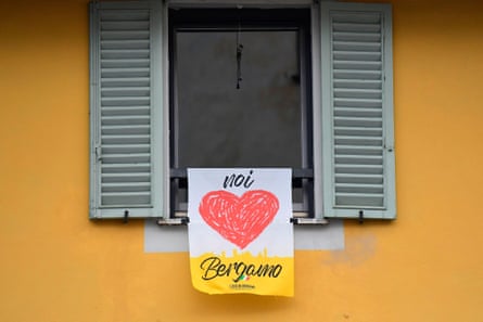 A banner reading ‘We love Bergamo’ hangs at a window in the upper part of the city.
