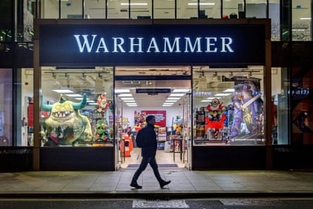 A person walks past a Warhammer store